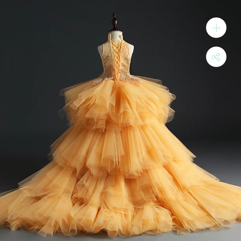 An elegant gold dress for girls in 7-8 sizes with a tail